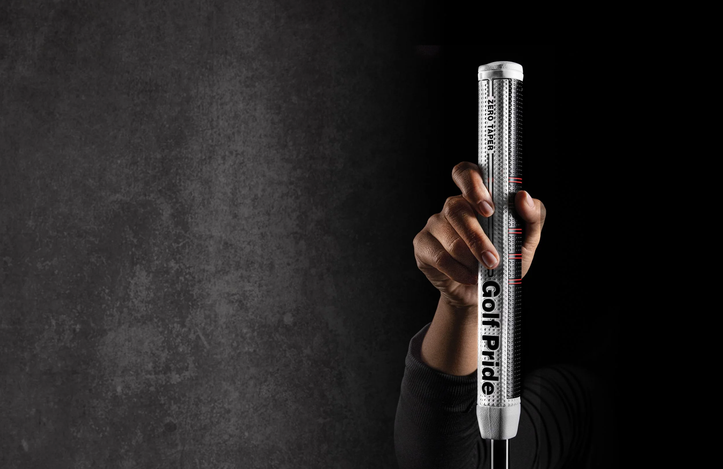 A hand holding a Golf Pride grip.