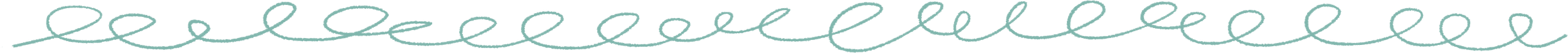 Close-up of a light blue decorative embroidered trim with a wavy, looping pattern.