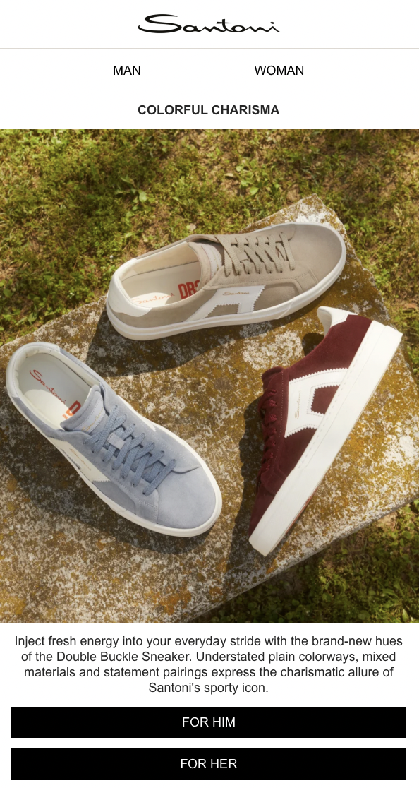 Three pairs of Santoni brand sneakers in beige, gray, and burgundy are displayed on a moss-covered stone surface outdoors.