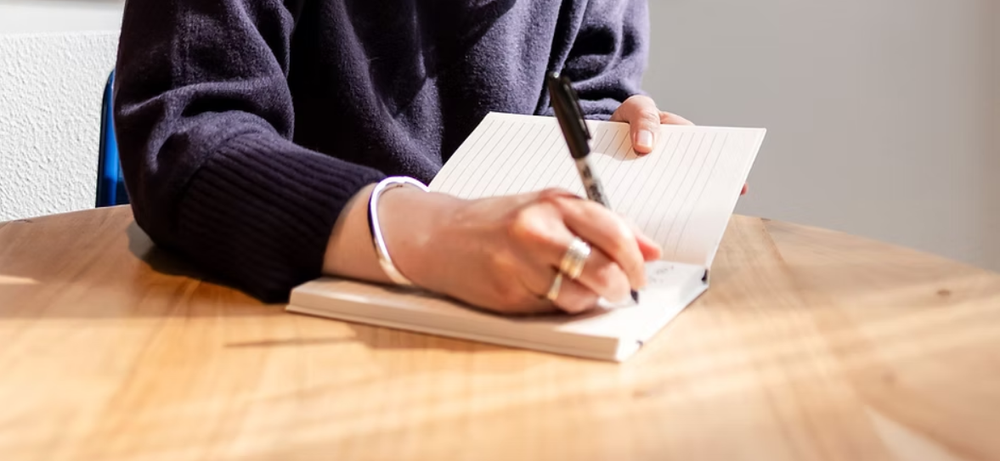 Writing in a notebook