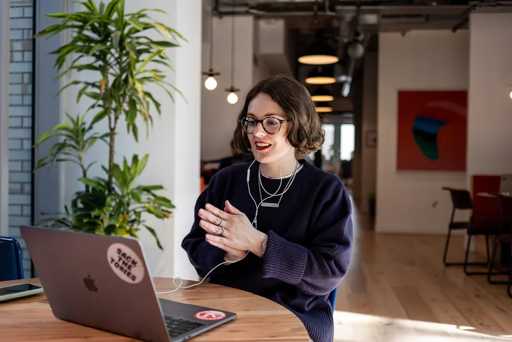 Vic seated at a laptop on a video call