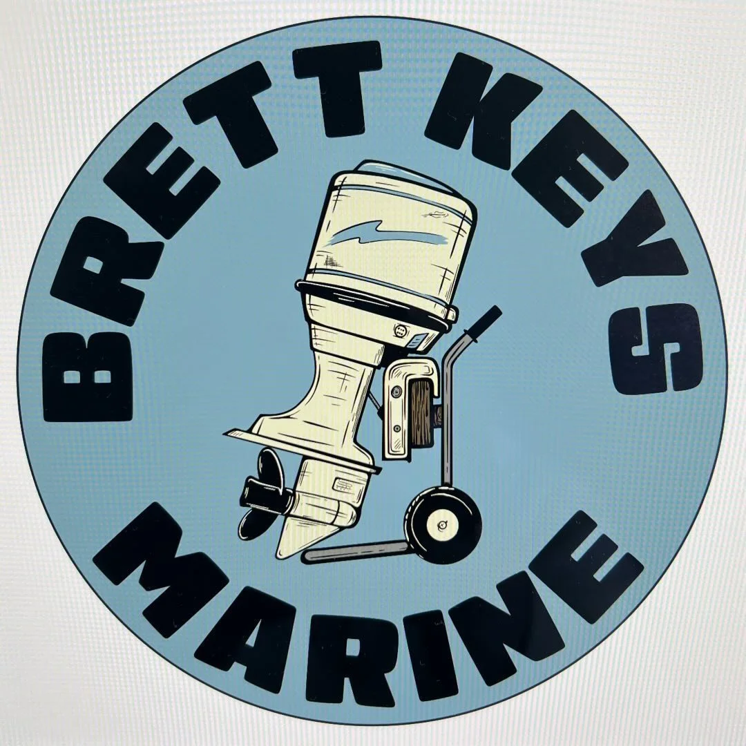 Logo with a boat motor on a dolly, surrounded by text 'Brett Keyes Marine' in black letters on a blue background.