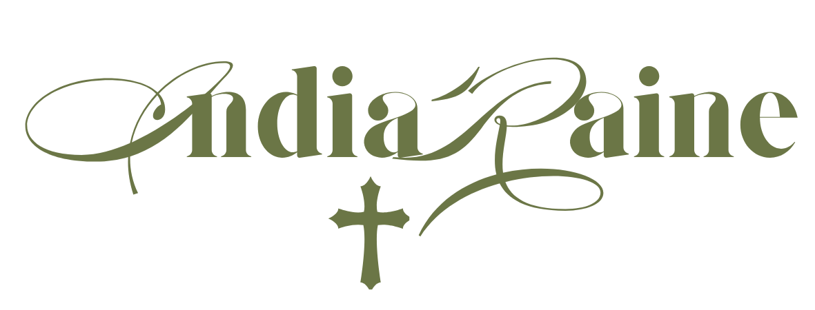 The word 'India' and 'Paine' in decorative script with a cross in between.