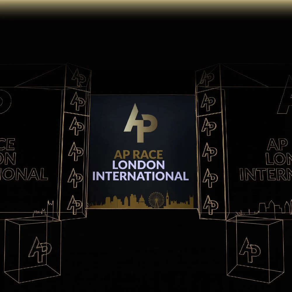 Stage setup for AP Race London International with large screens and logos, featuring the London skyline silhouette and a Ferris wheel.