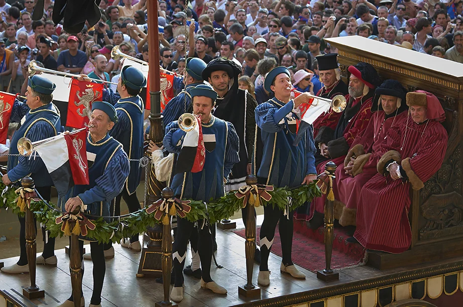   Dignitaries and Trumpeters.