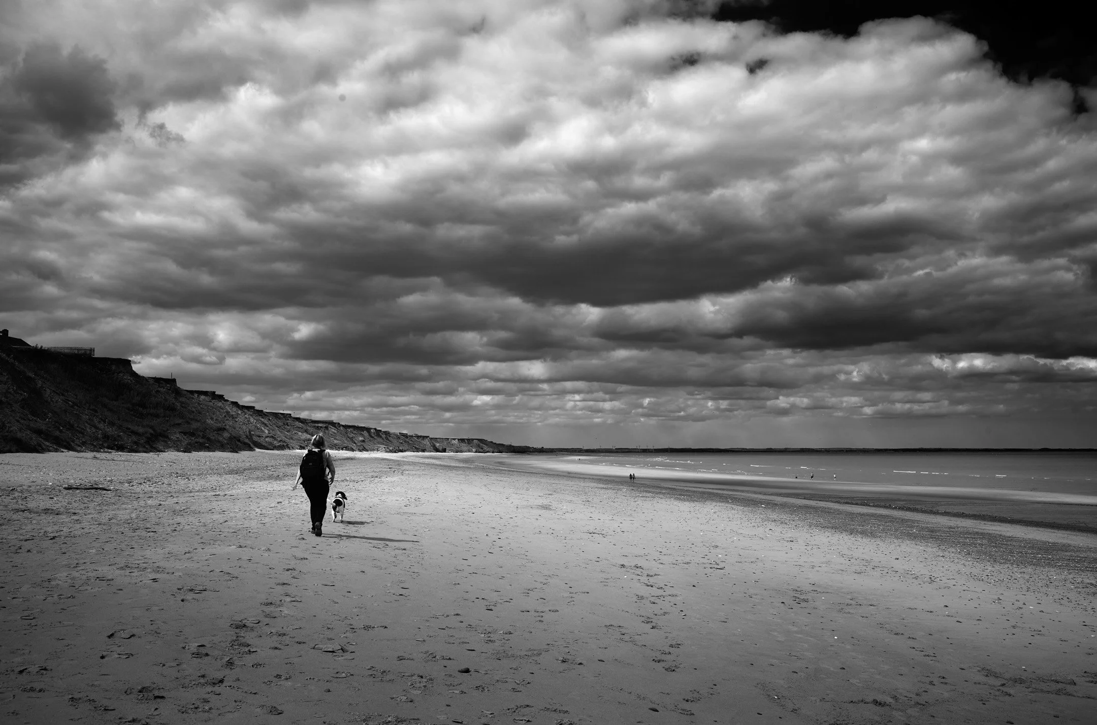Walking on the beach under a big sky.