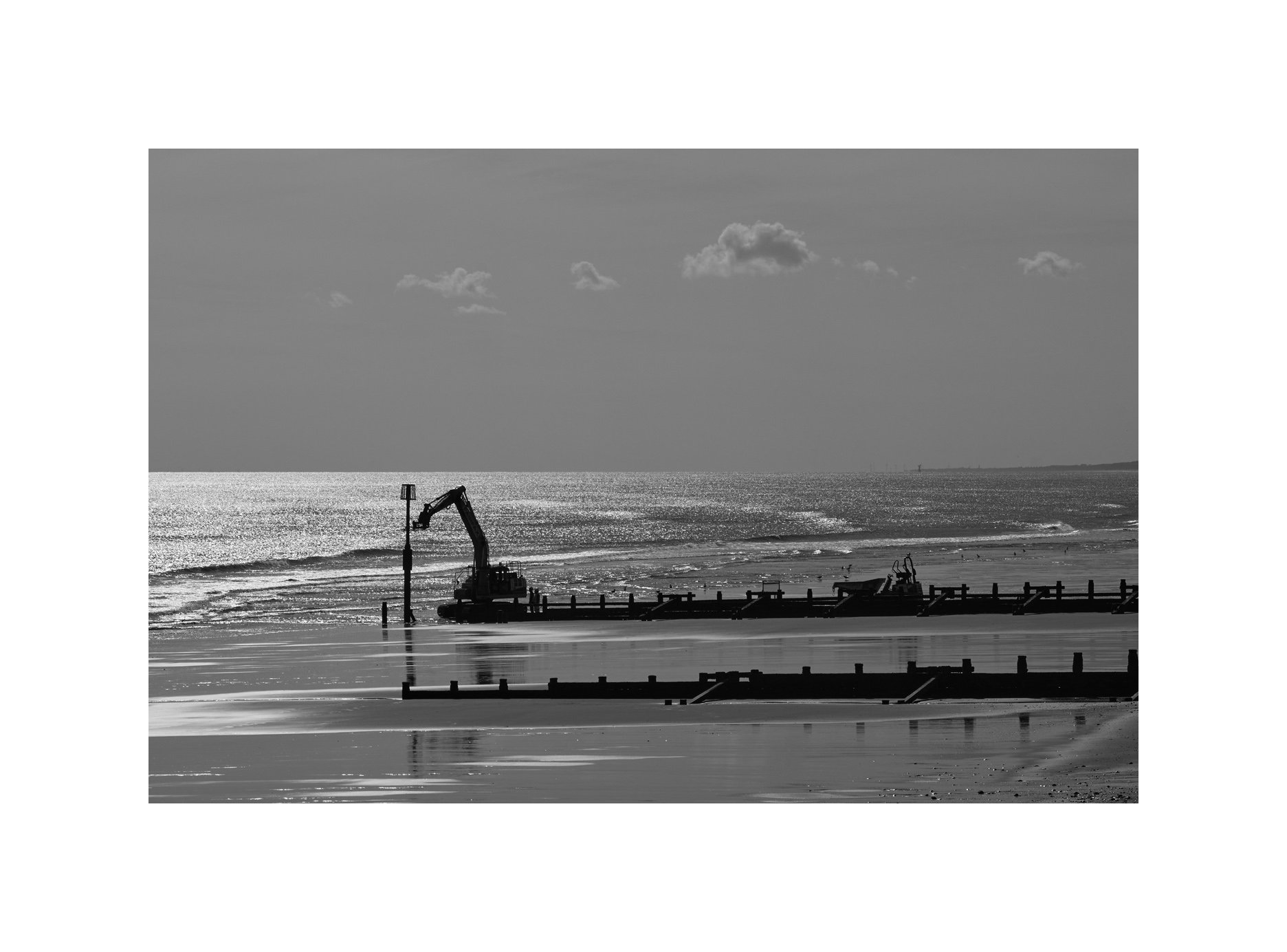 Another digger on the beach. Beacon replacement.

#Hornsea 
#Beach 
#Digging 
#Leica 
#bwphotography