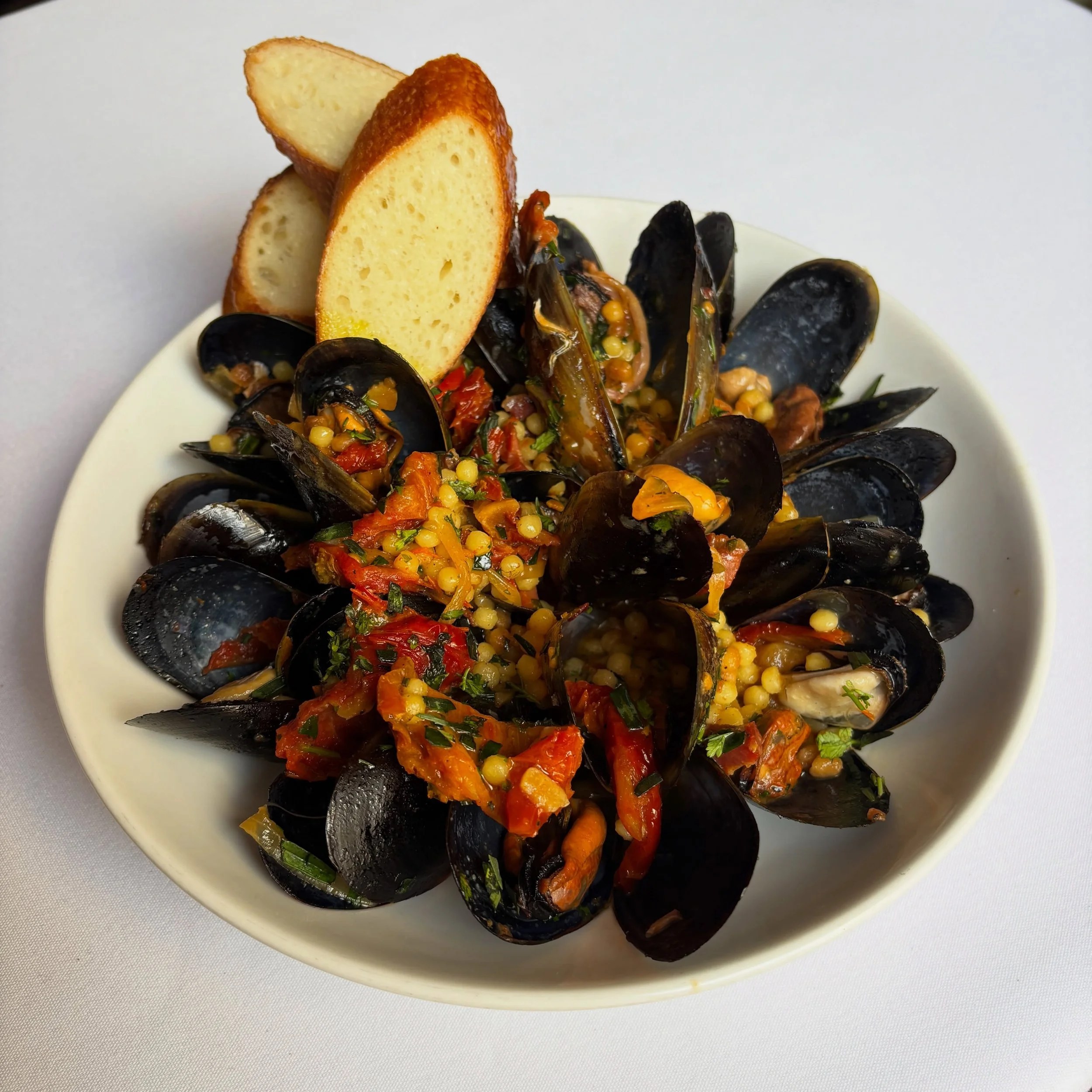 ~ 𝓟𝓵𝓪𝓽 𝓭𝓾 𝓑𝓪𝓻 ~

Mussels with fregola, tomato and jam&oacute;n, the sweetness of the shellfish and tomato balanced by the salty richness of the ham, with a little chilli and parsley.

This week&rsquo;s counter meal in the wine bar: $35 with 