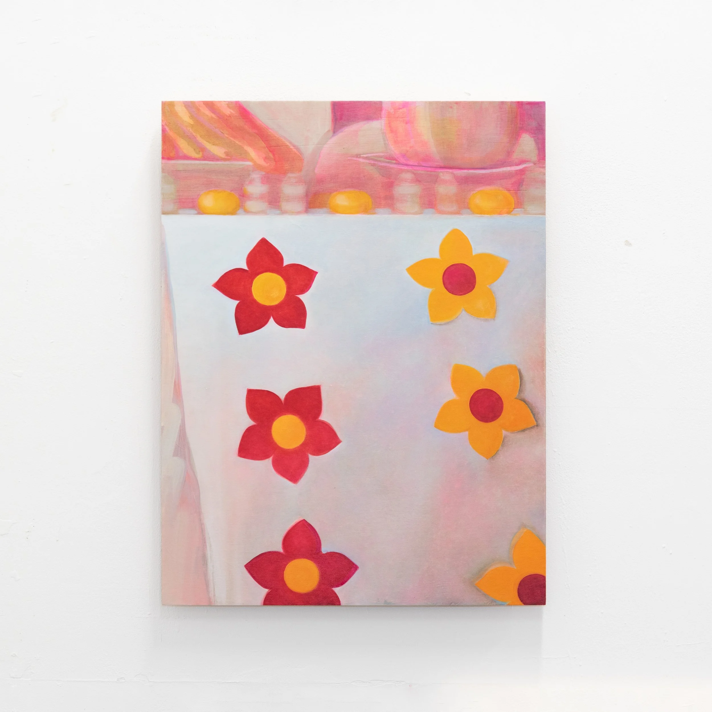 Close-up of a colorful, abstract painting on white paper with red and orange flowers at the bottom.