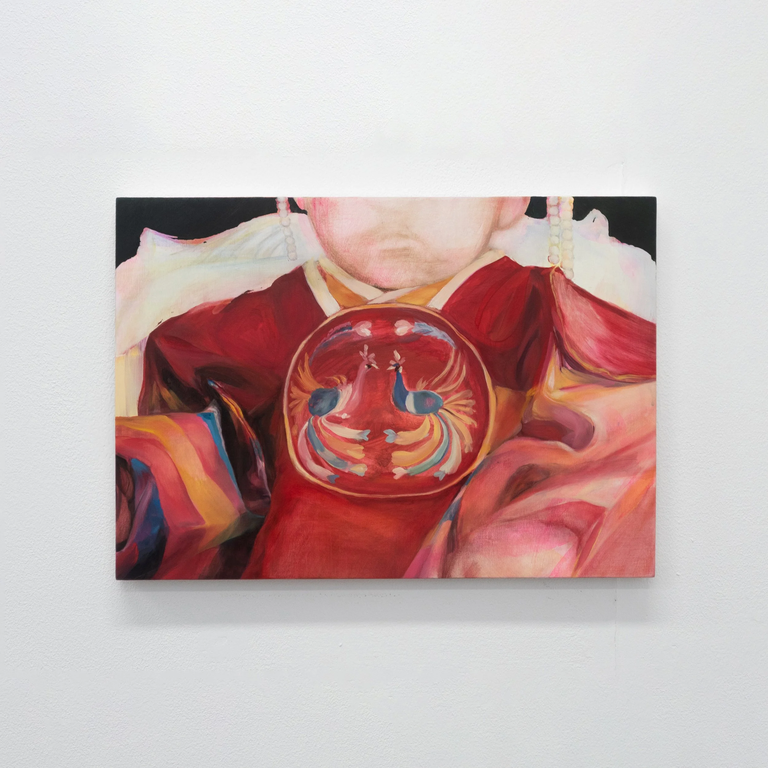A colorful painting of a person with a red shirt and pearl necklace, holding a bowl with a butterfly design, displayed on a white wall.