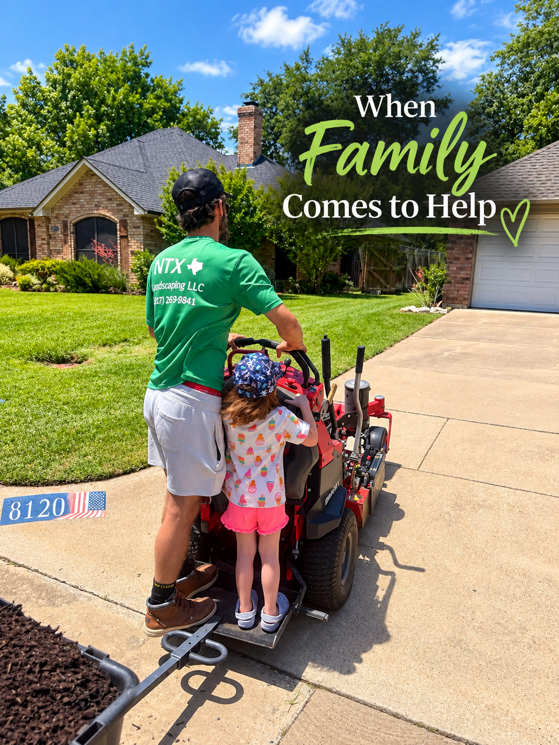 A man and a young girl walking on a suburban driveway with a ride-on lawn mower. The man is wearing a green t-shirt with company information and a black cap, while the girl is wearing a hat and colorful shorts. There are houses, trees, and a partly cloudy sky in the background. Text overlay reads, "When Family Comes to Help" with a small heart.