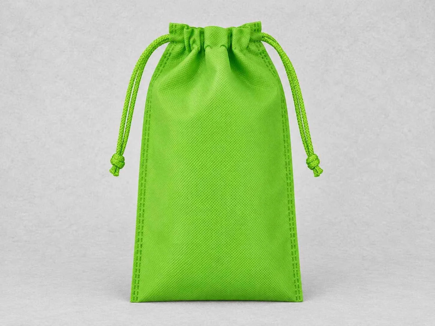 Bright green cambrel bag on a gray background.