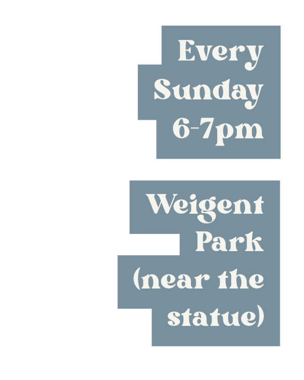 Sign advertising weekly event at Weigant Park near the statue, every Sunday from 6 to 7 pm.