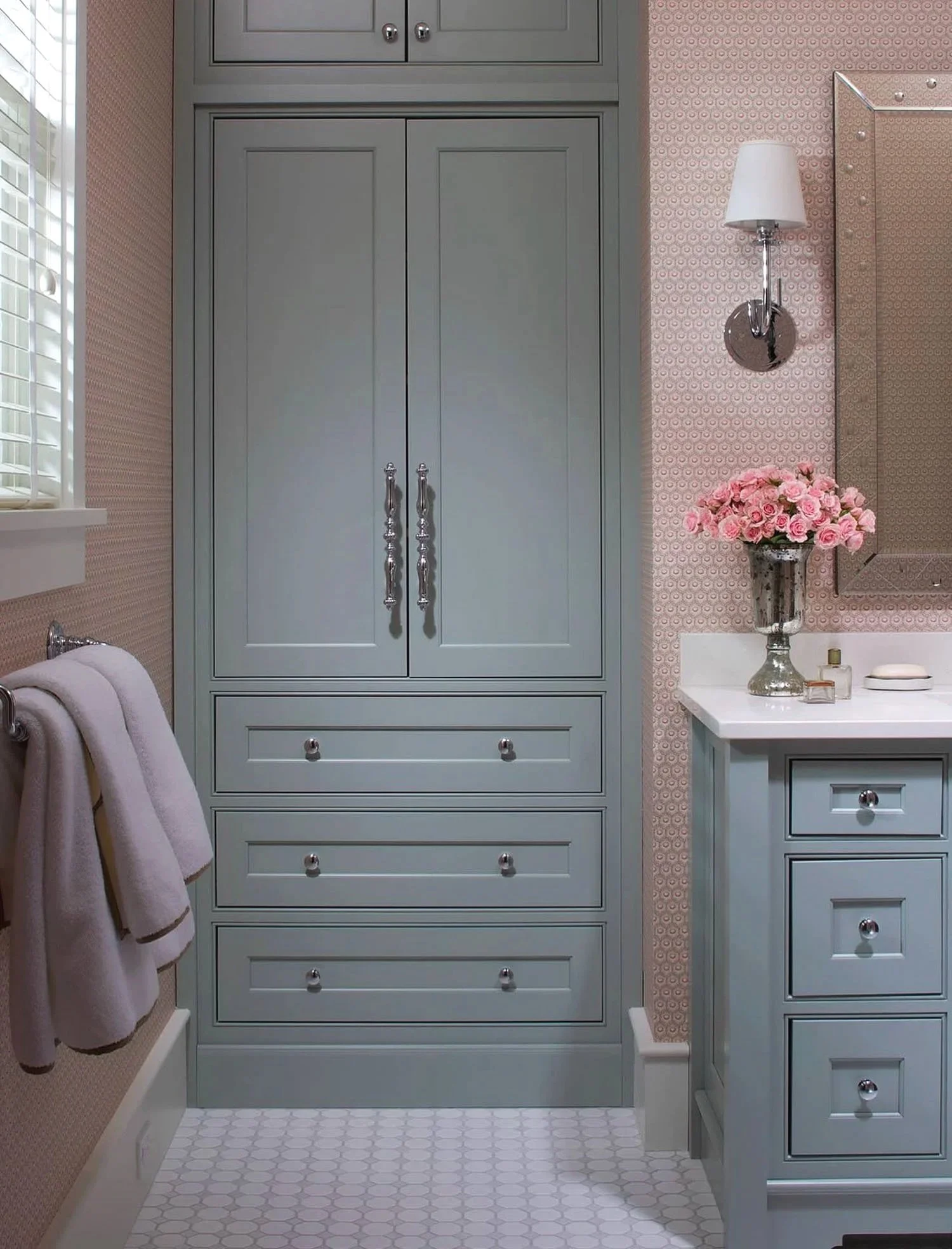 Custom gray bathroom storage cabinetry and vanity millwork built to fit the space by Rift & Quarter