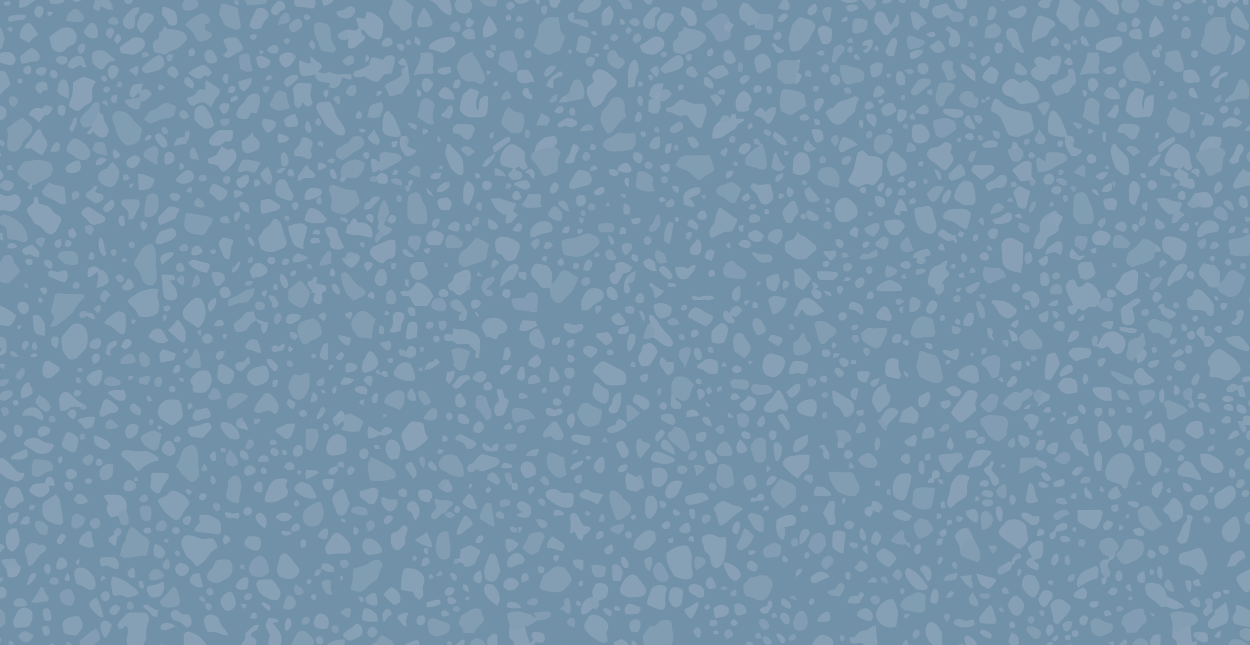 A blue textured surface with small, irregularly shaped light blue and darker blue patches.
