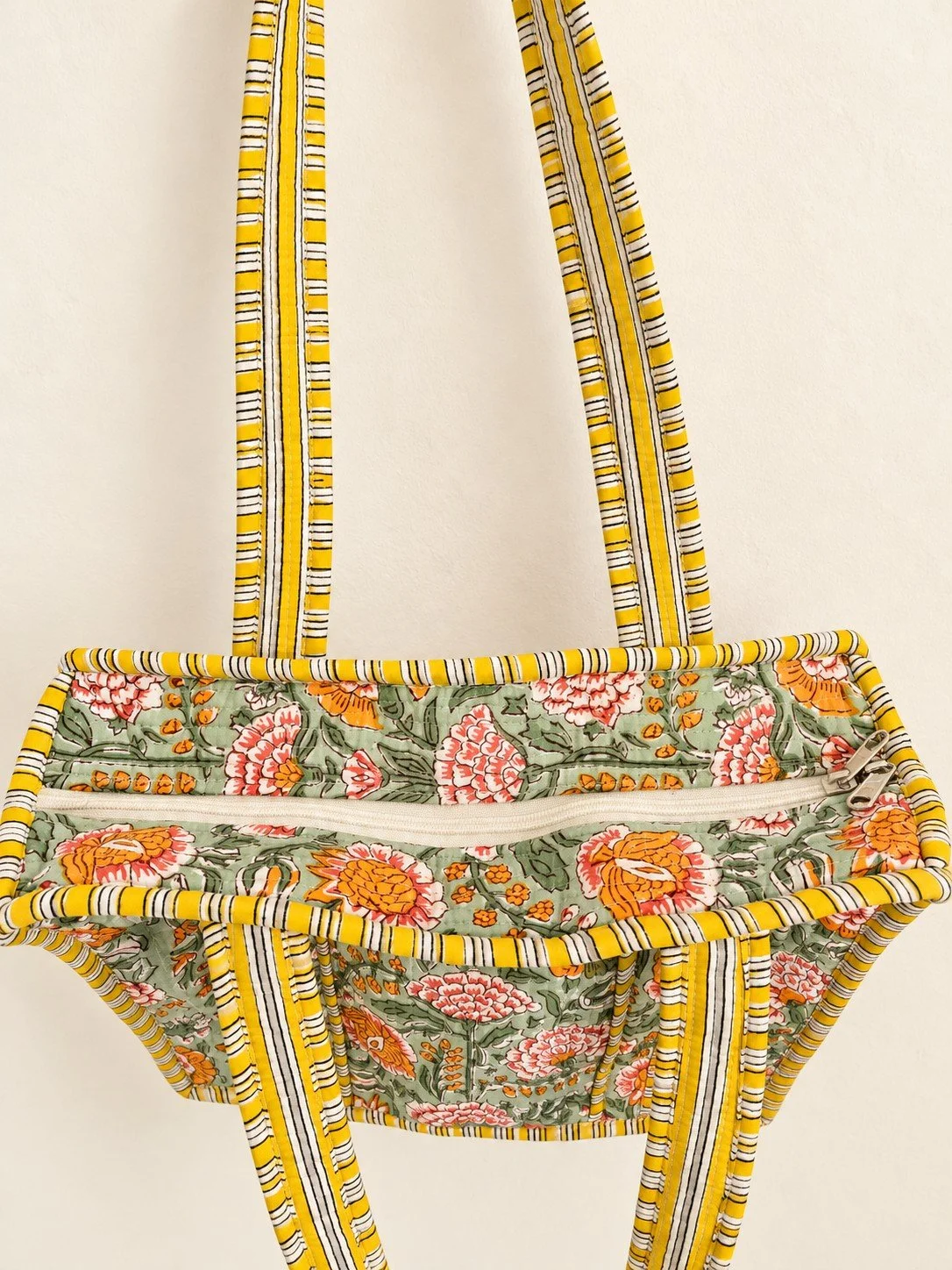 Quilted Floral Tote Bag on Cream Wall.jpg