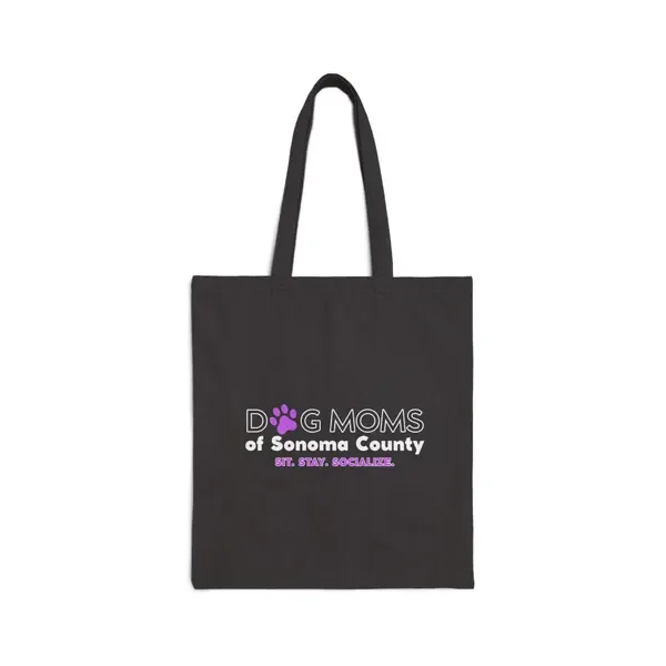 Black tote bag featuring the “Dog Moms of Sonoma County” logo and slogan “Sit. Stay. Socialize.”