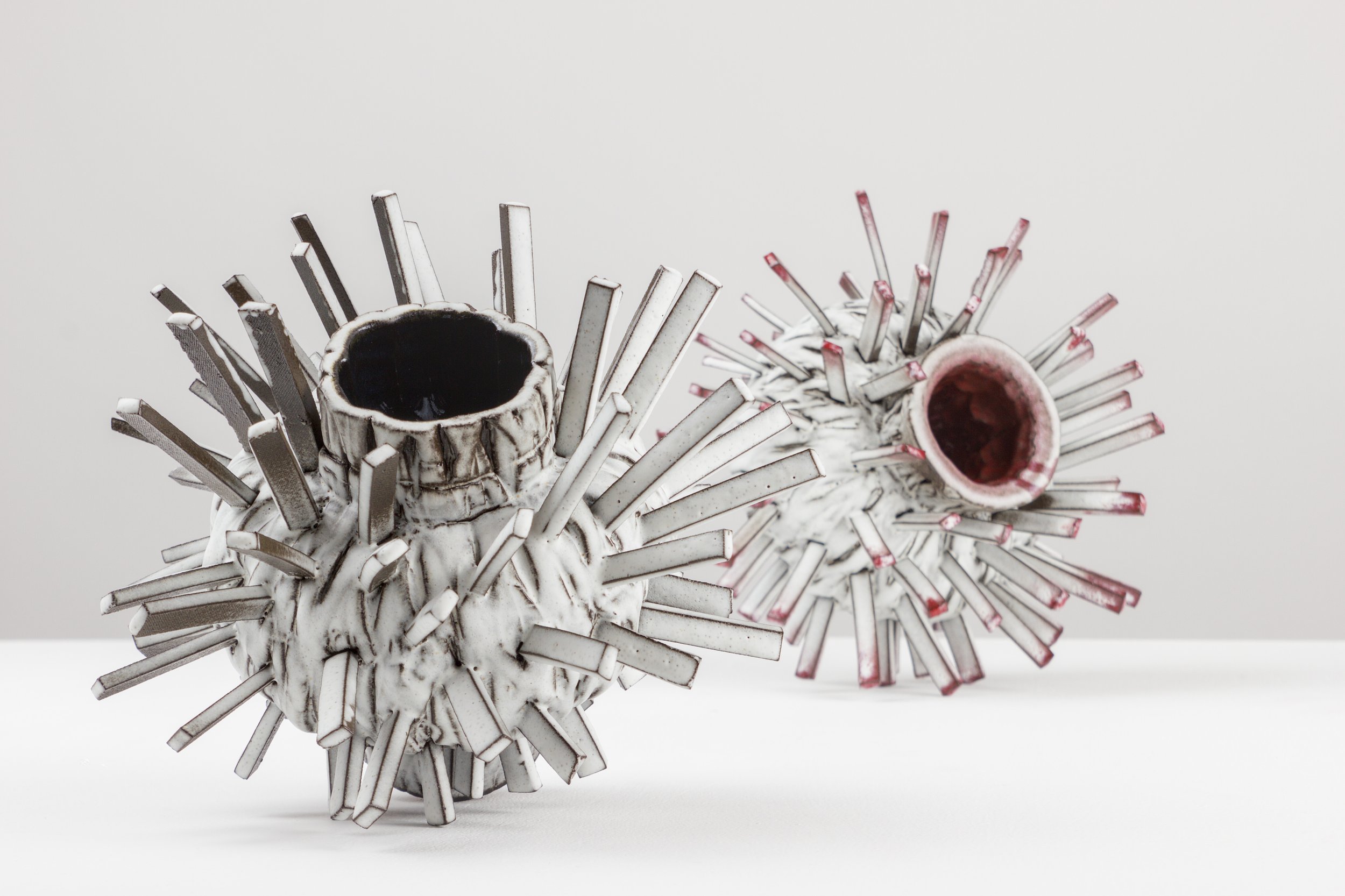 sea urchin I+II, 2025. black clay, glaze. 20x23x24cm