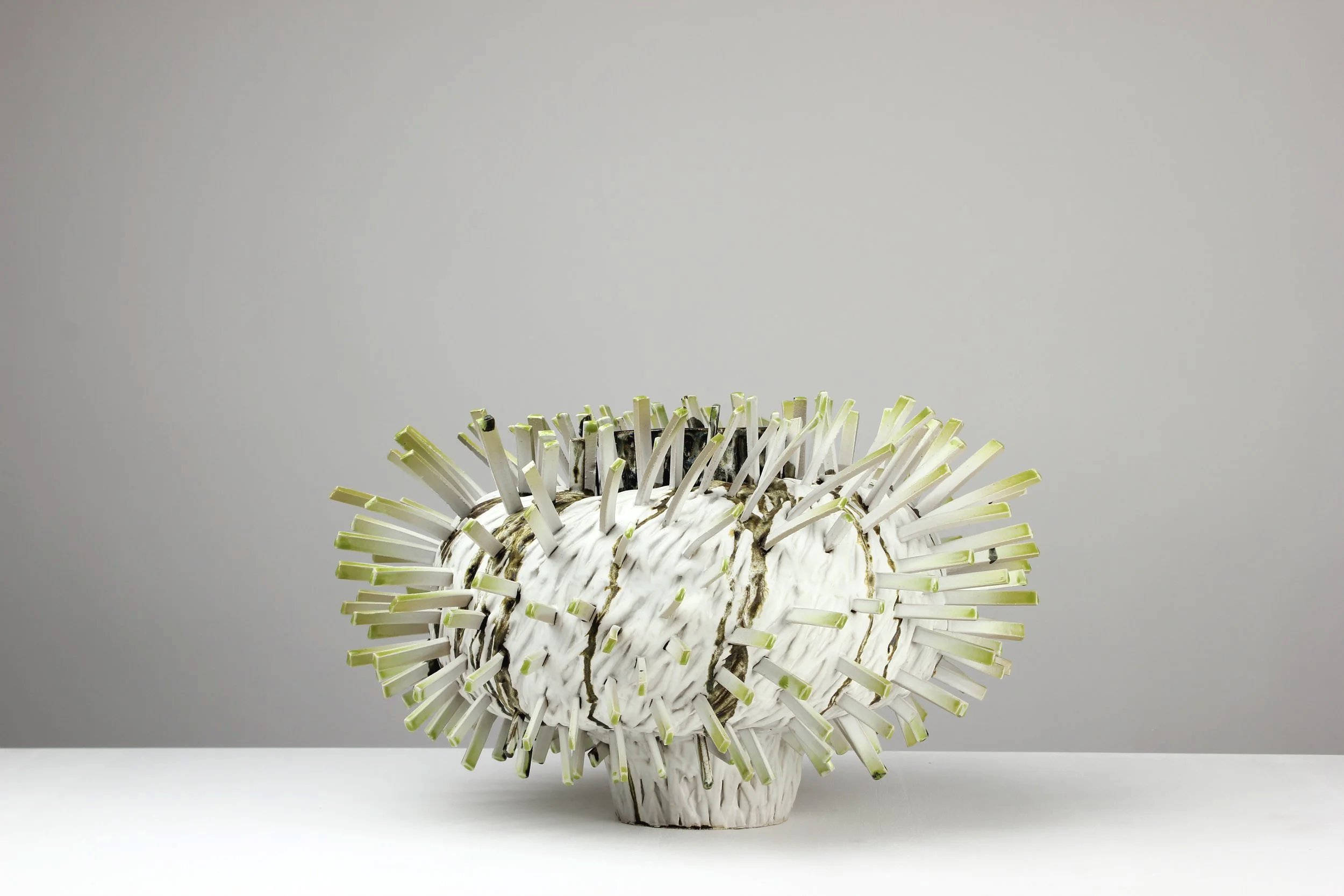 Glowing in the dark, 2025. White clay, engobe, glaze. 35x48x50cm