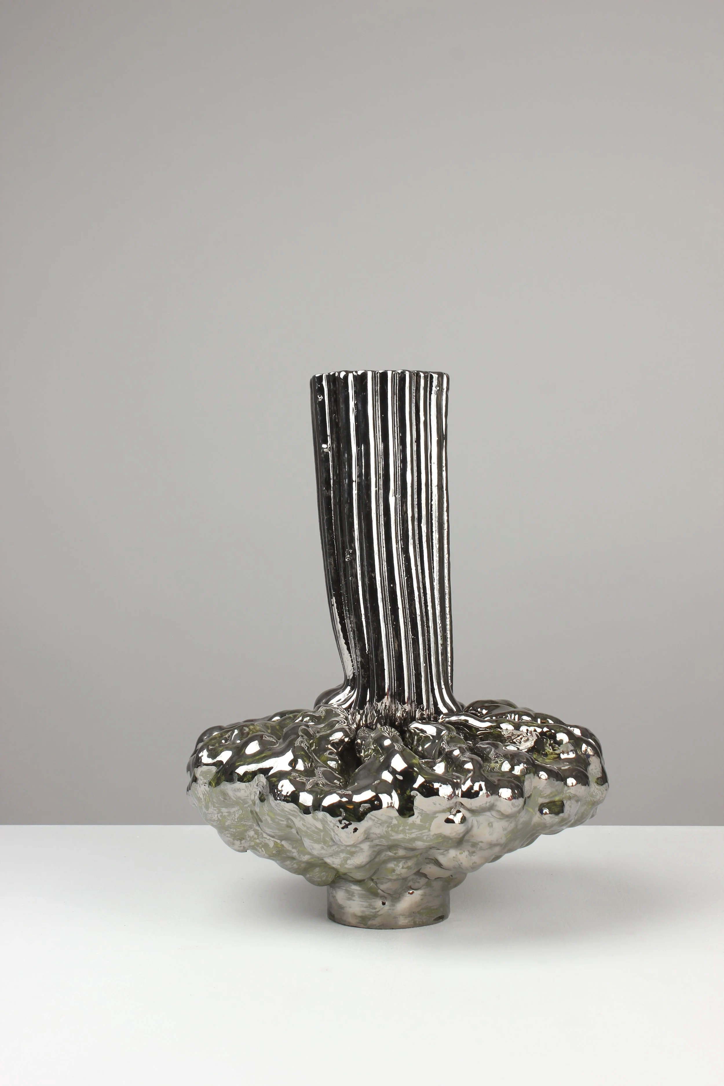 Extruder vase, 2024. White clay, engobe, glaze, platinum. 40x30x25cm