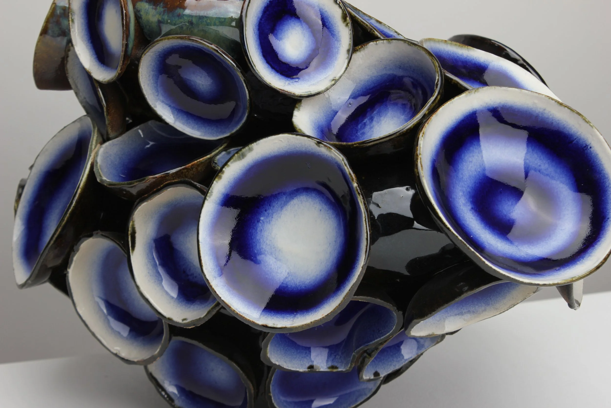DETAIL Jungle Echoes, 2026.
White clay, engobe, glaze. 
62x53x45cm