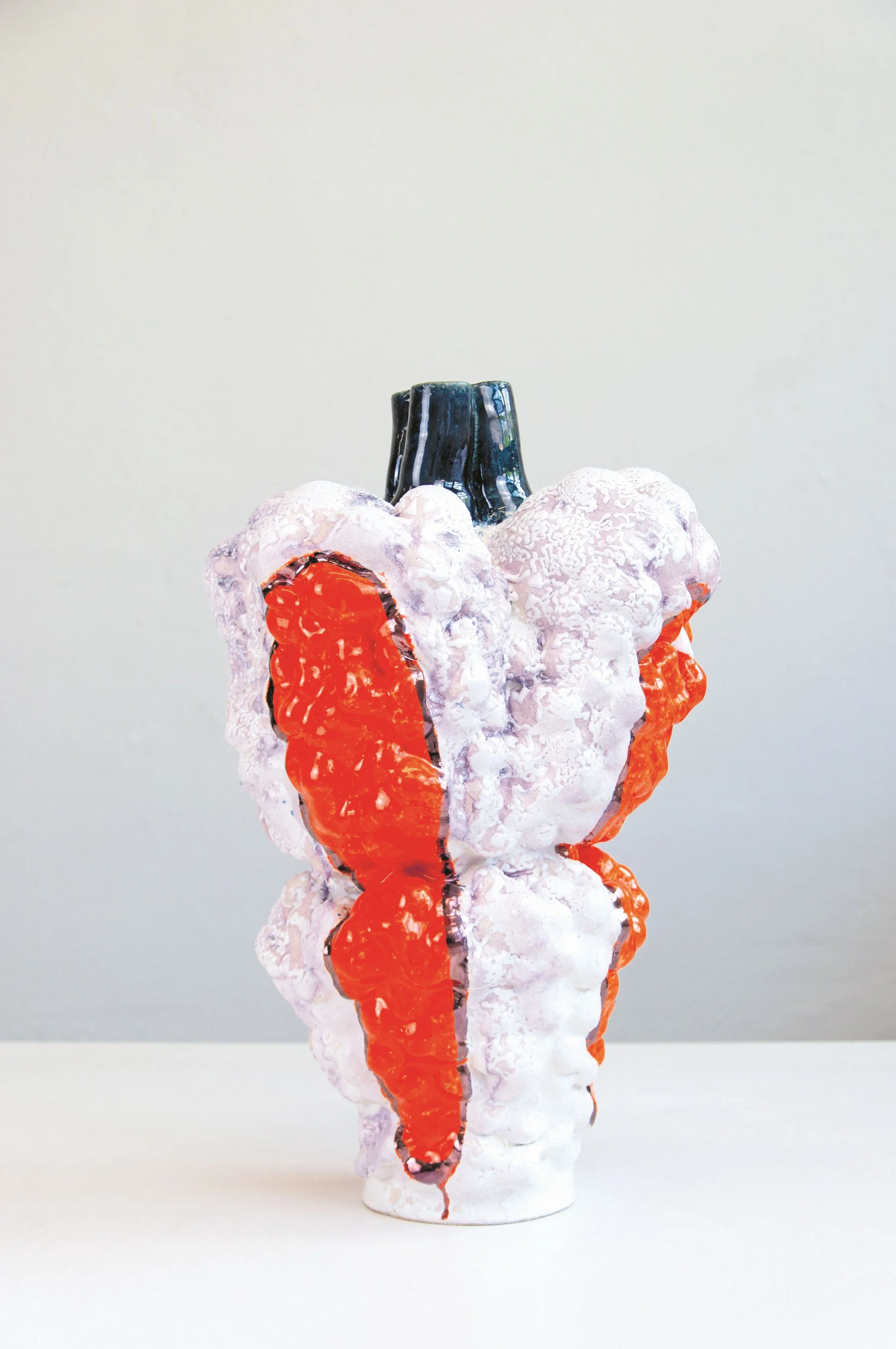 Wwin (orange), 2024. White clay, engobe, glaze, lustre. 50x35x33cm