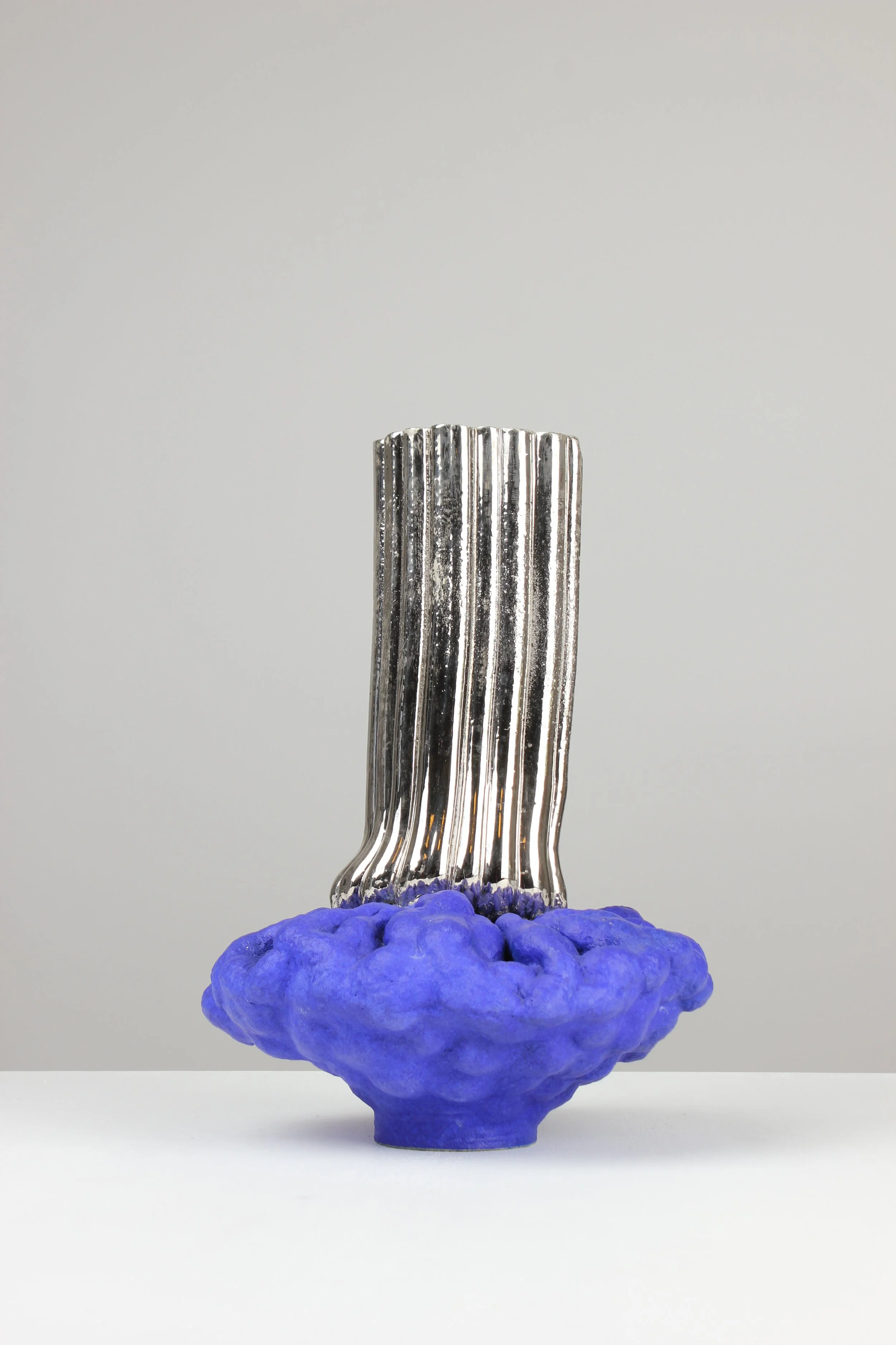 Extruder vase, 2024. White clay, engobe, glaze, platinum. 30x22x20cm