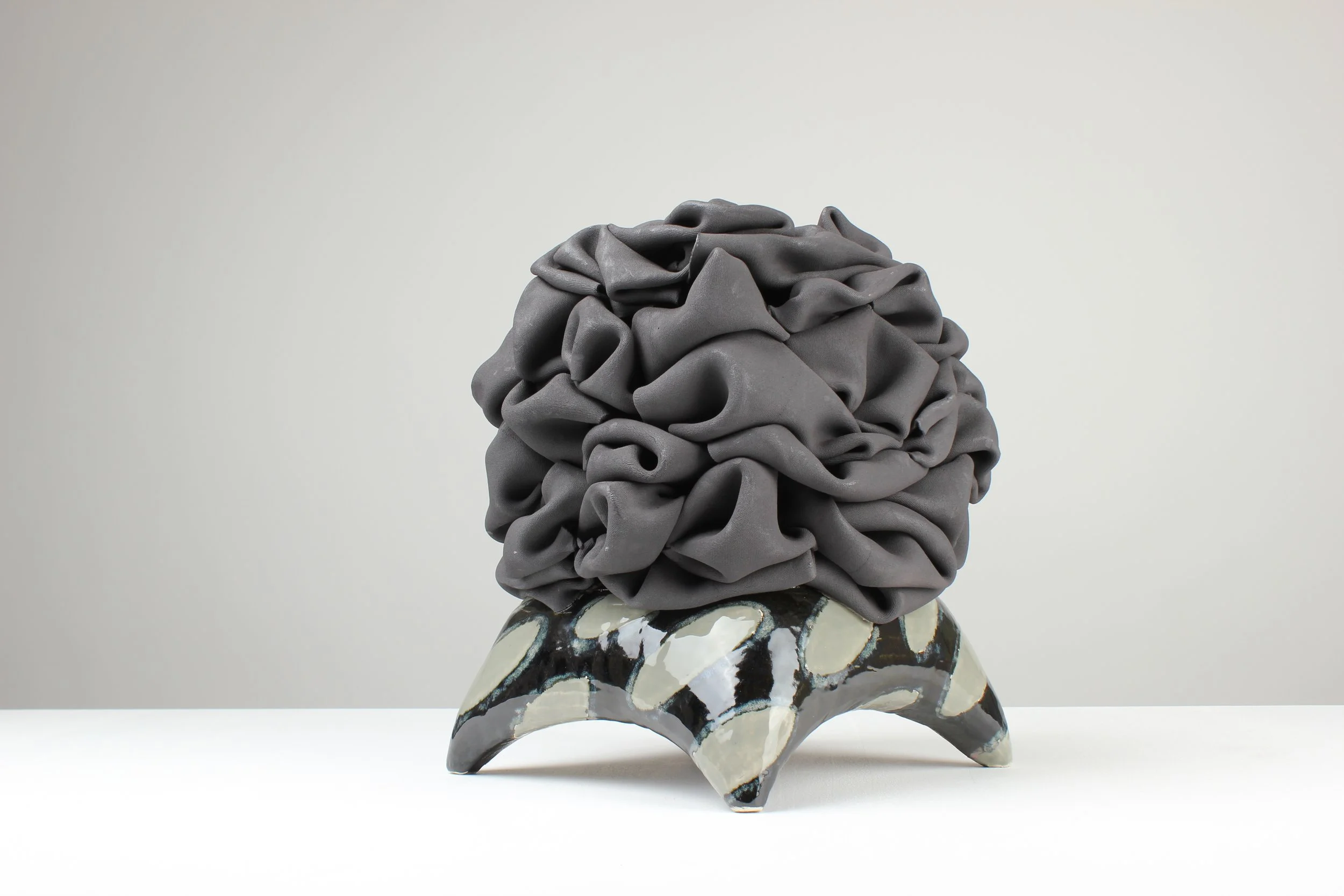 Faltengebirge III, 2025. Black clay, white clay, engobe, glaze, lustre. 38x35x35cm 