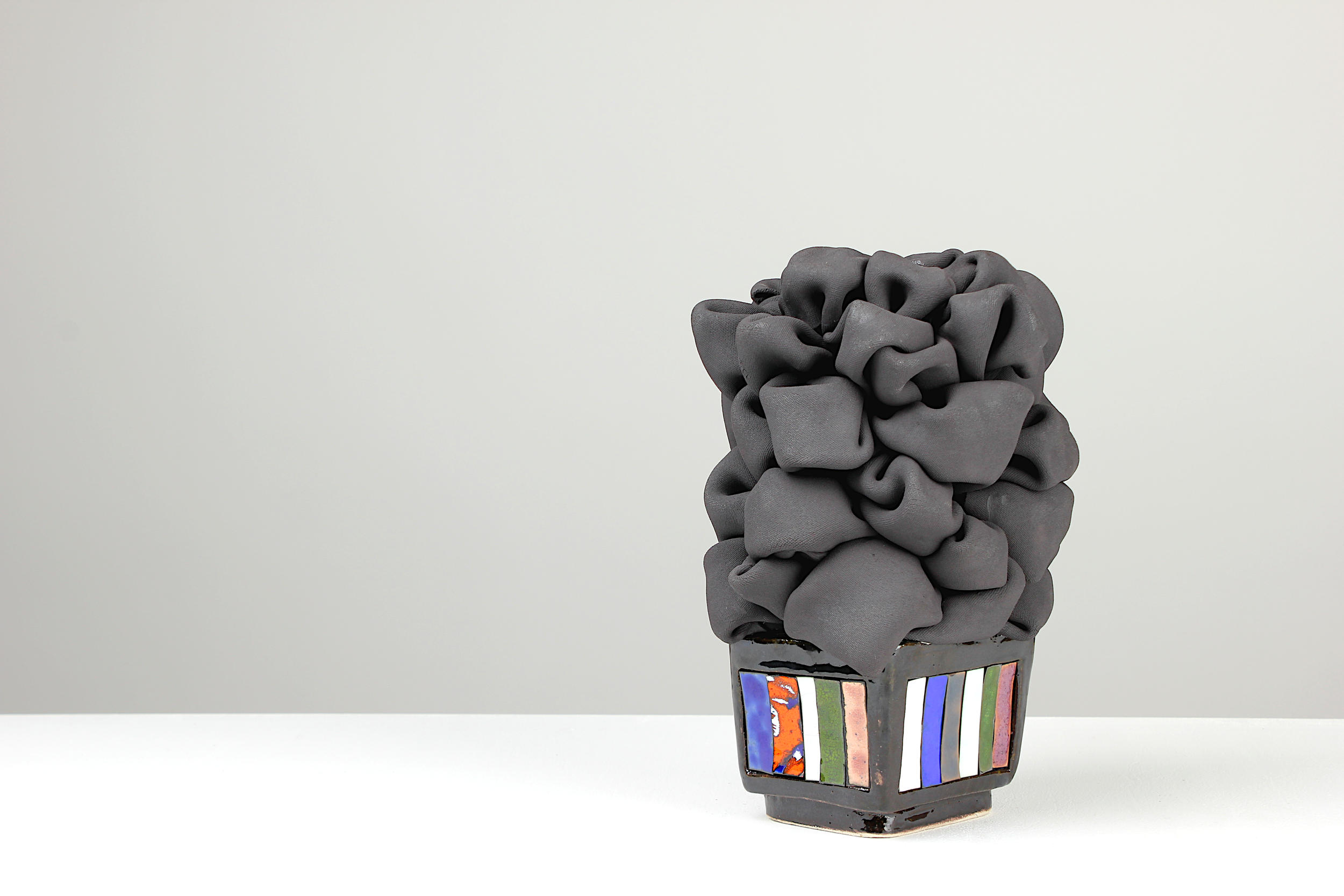 #11/12/25, 2025. White clay, black clay, engobe, glaze, copper, emaille.
28x18x18cm