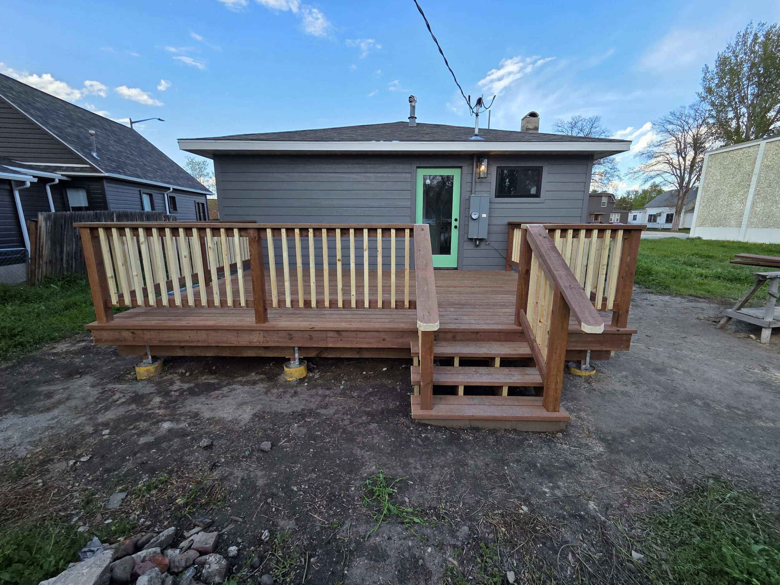 Custom backyard deck renovation on a Logan, Utah home with fenced yard
