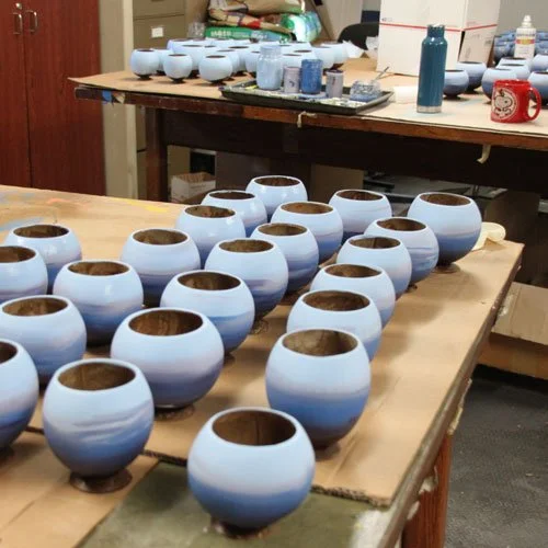 Each coconut cup is painted with the light blue, royal blue  and purple individually. Each one is a piece of art once finished.