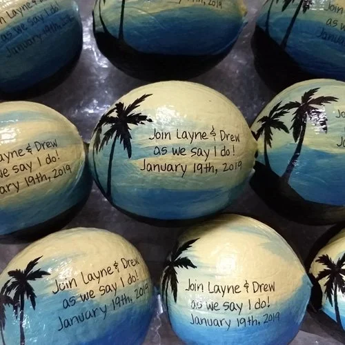 We can drop ship any painted coconut to your wedding list, or send all to  you for distribution. Feel free to send us additional items to include in the boxes: leis,  RSVPs, maps even sea shells