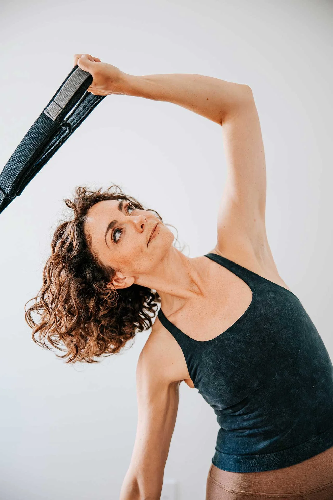 Pilates instructor, Kim Witzberger in a deep side bend
