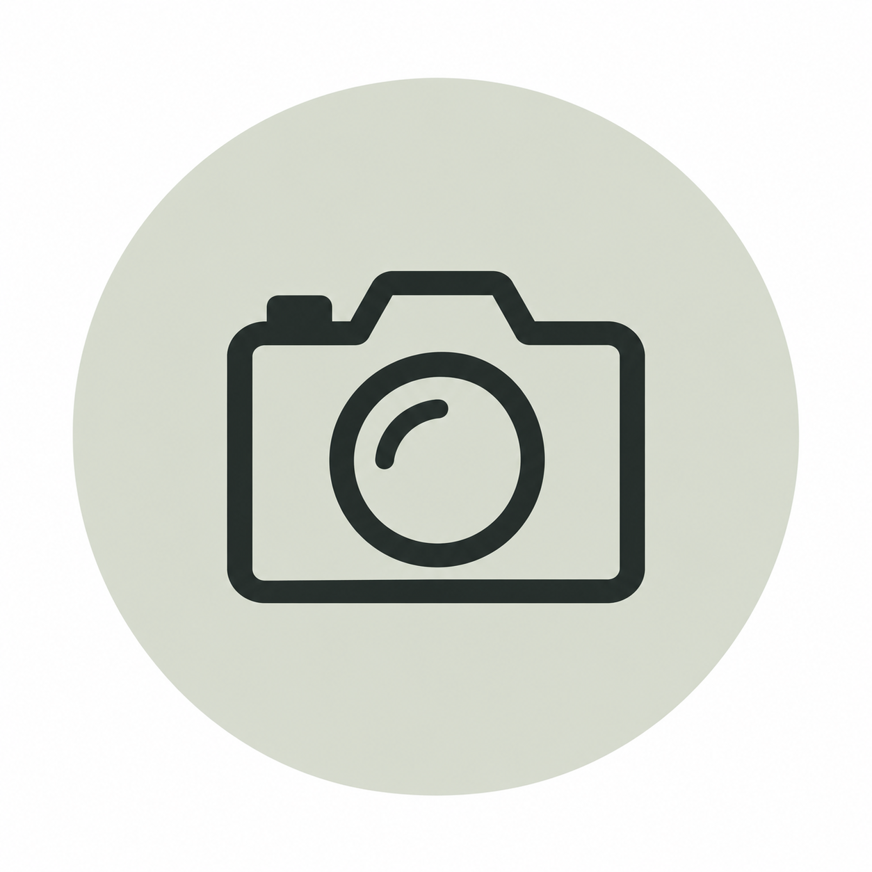 Image of a camera icon with a lens in the center, indicating a photo or image placeholder.
