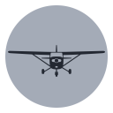 Front view of a small airplane flying towards the viewer