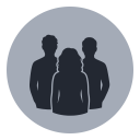 Silhouette of three people standing together against a circular background