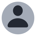 Generic user avatar icon with a gray circular background and a simplified silhouette of a person.