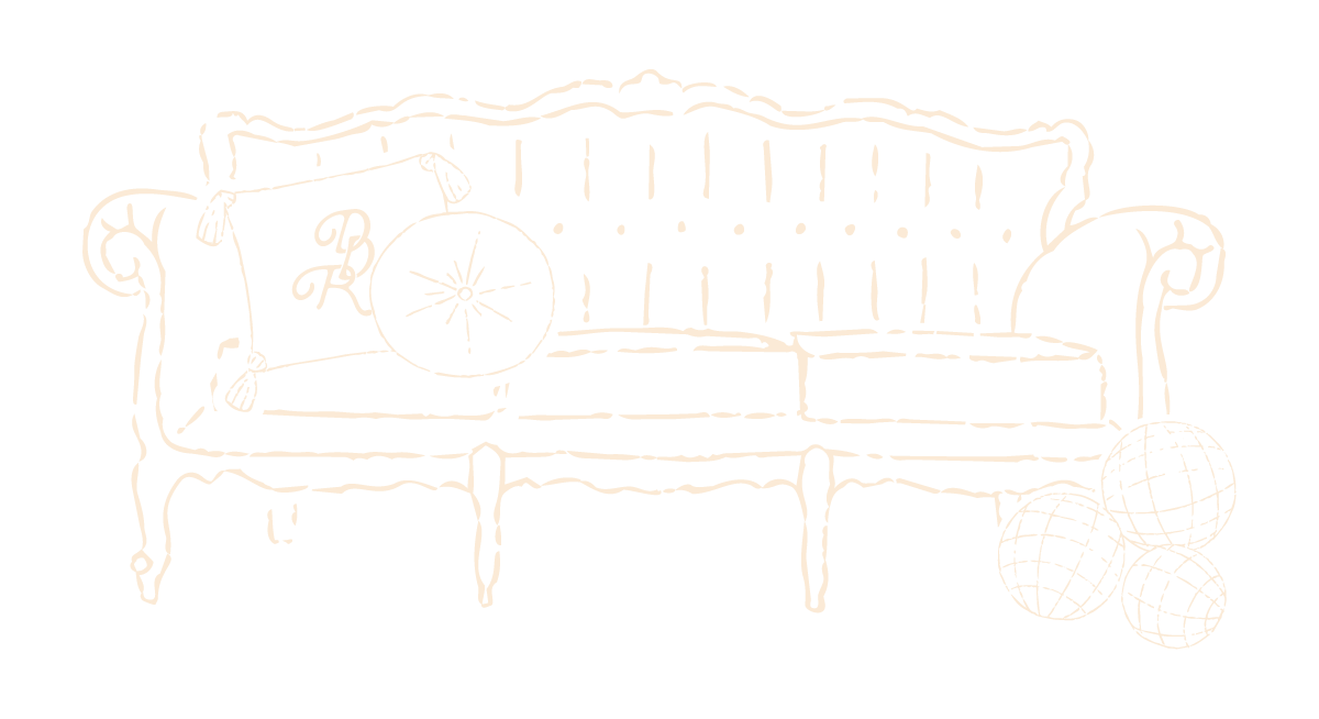 Vintage-style line drawing of an ornate sofa with a monogrammed cushion and three disco balls beside it.