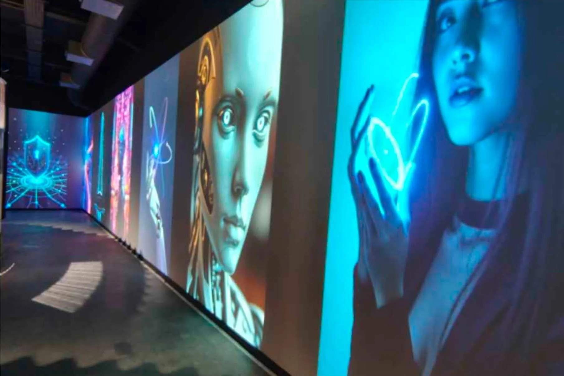 Digital artwork display featuring futuristic and sci-fi themed characters and symbols, with vibrant blue, purple, and neon colors.