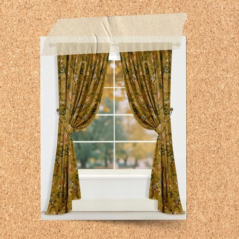 Ochre floral velvet curtains framing a window