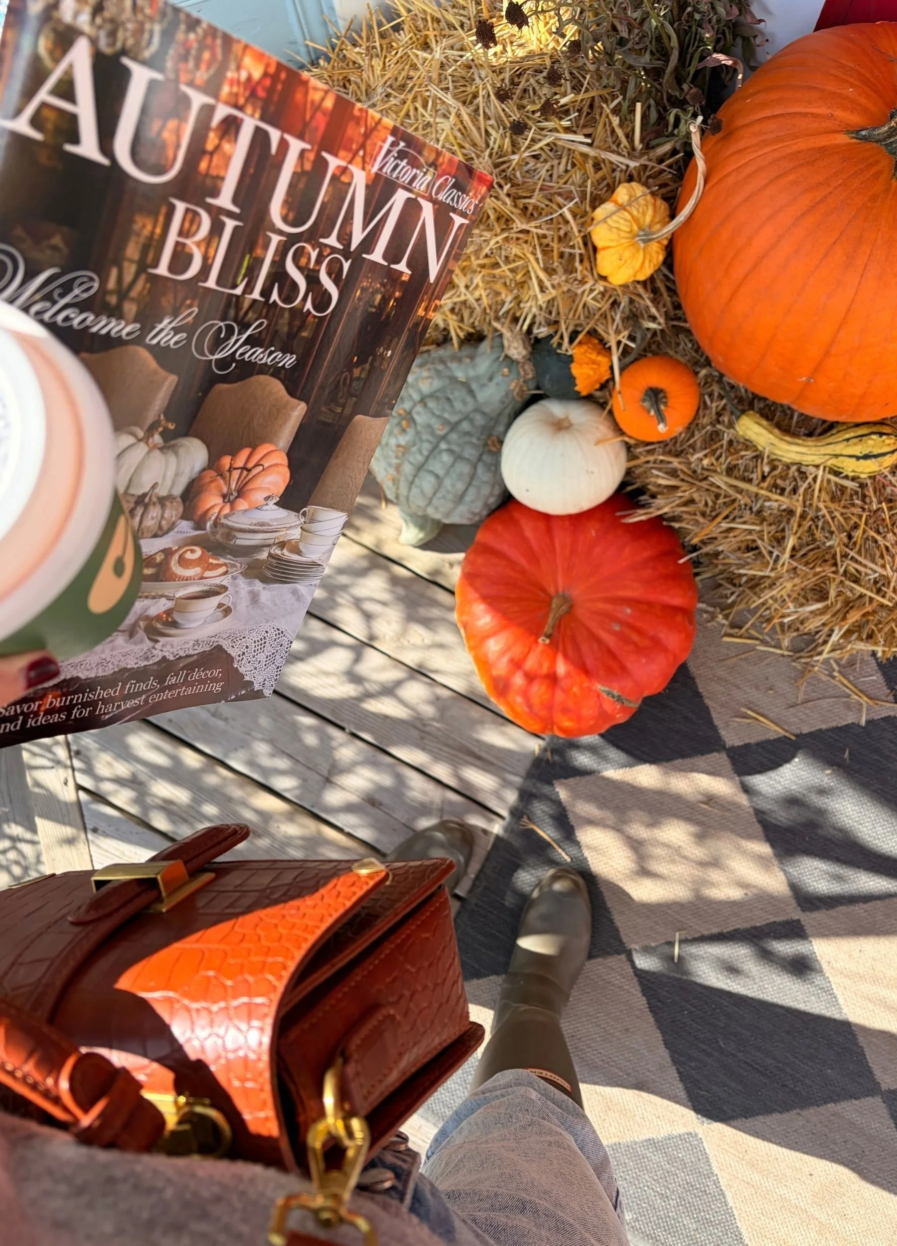 Autumn magazine, pumpkins and coffee on a sunny October day