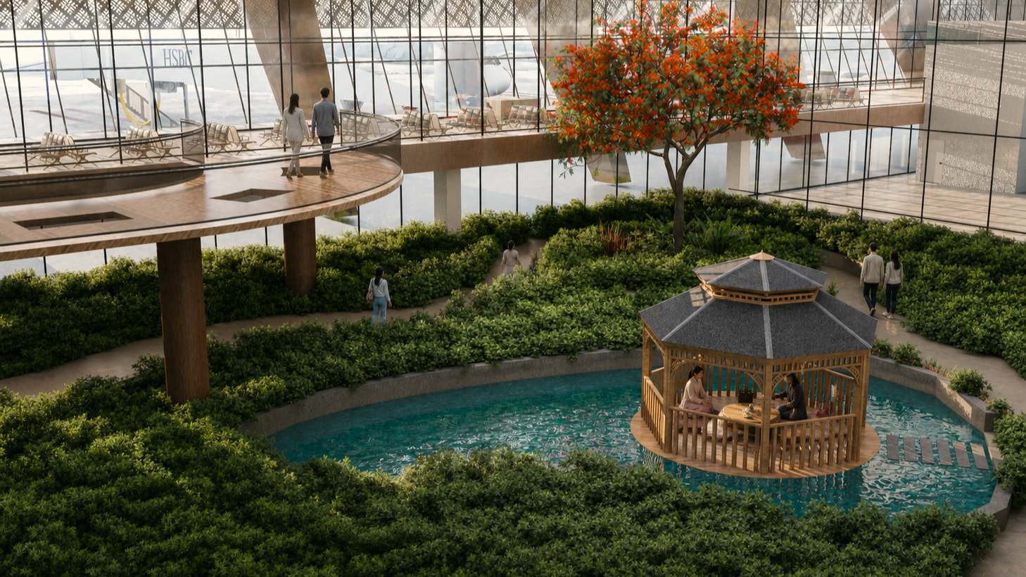 Indoor garden with a small pond, a wooden gazebo with two people inside, a tree with orange flowers, and a glass-roofed waiting area with chairs.