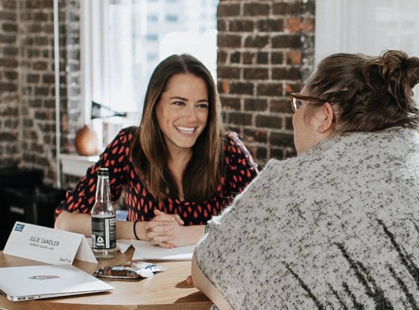 Venture capitalist Julie Sandler in conversation with a local founder at Female Founder's Alliance event hosted by Graham & Walker.