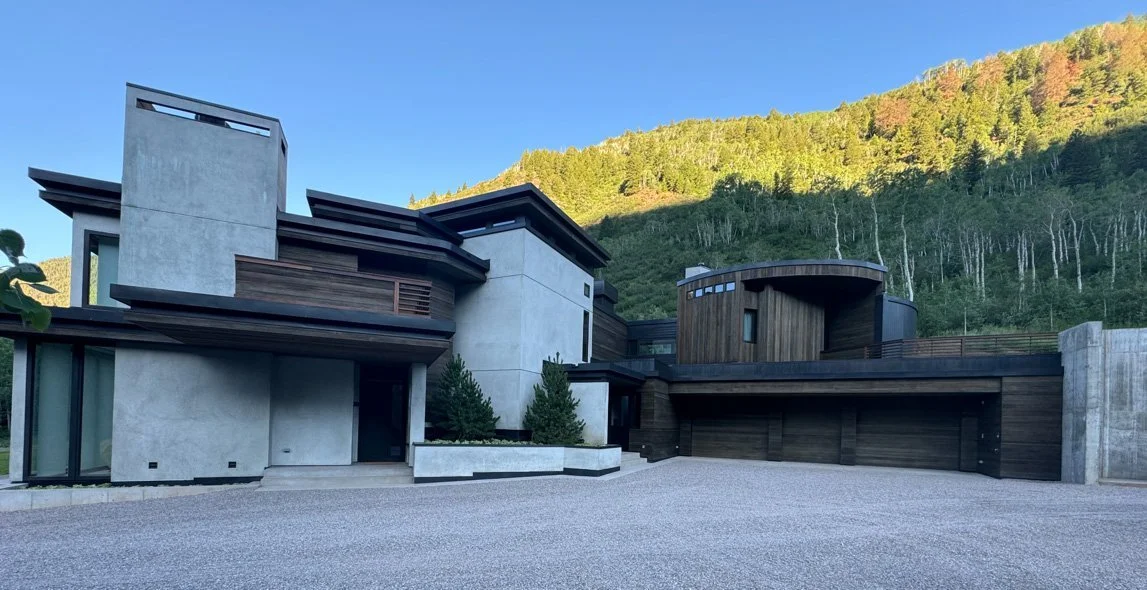 Modern residential home with terraced lawn nestled in the mountains built by Form 44 Construction near Conundrum Creek in Aspen, CO