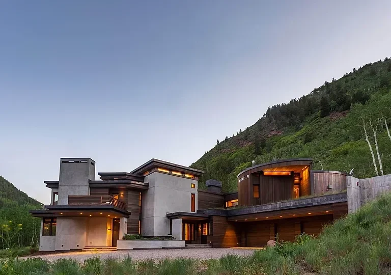 Modern residential home with terraced lawn nestled in the mountains built by Form 44 Construction near Conundrum Creek in Aspen, CO