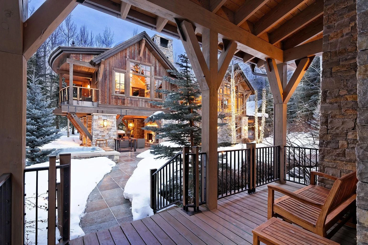 A luxurious two-story stone and wood mountain home built by John Olson, owner of Form 44 Construction in Aspen, Colorado