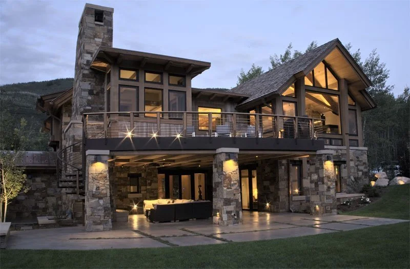 Exterior photo at dusk of a residential mountain home built by John Olson, owner of Form 44 Construction, on Crystal Lake Road in Aspen, CO