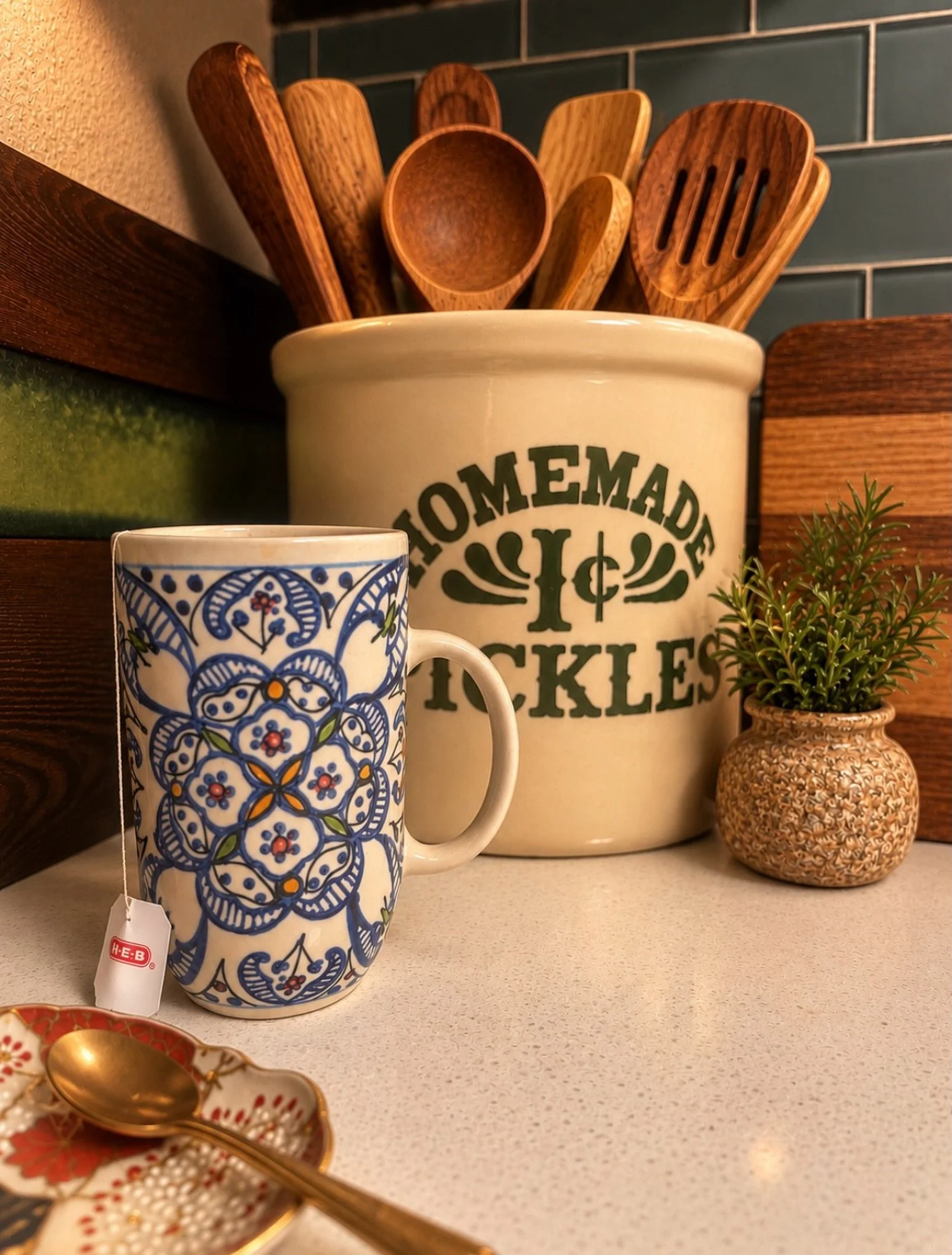 It&rsquo;s the little moments that make a house feel like home.

A favorite patterned mug, a vintage crock filled with warm wooden utensils, a touch of greenery, and a delicate brass spoon resting on a charming little dish. Each piece brings its own 
