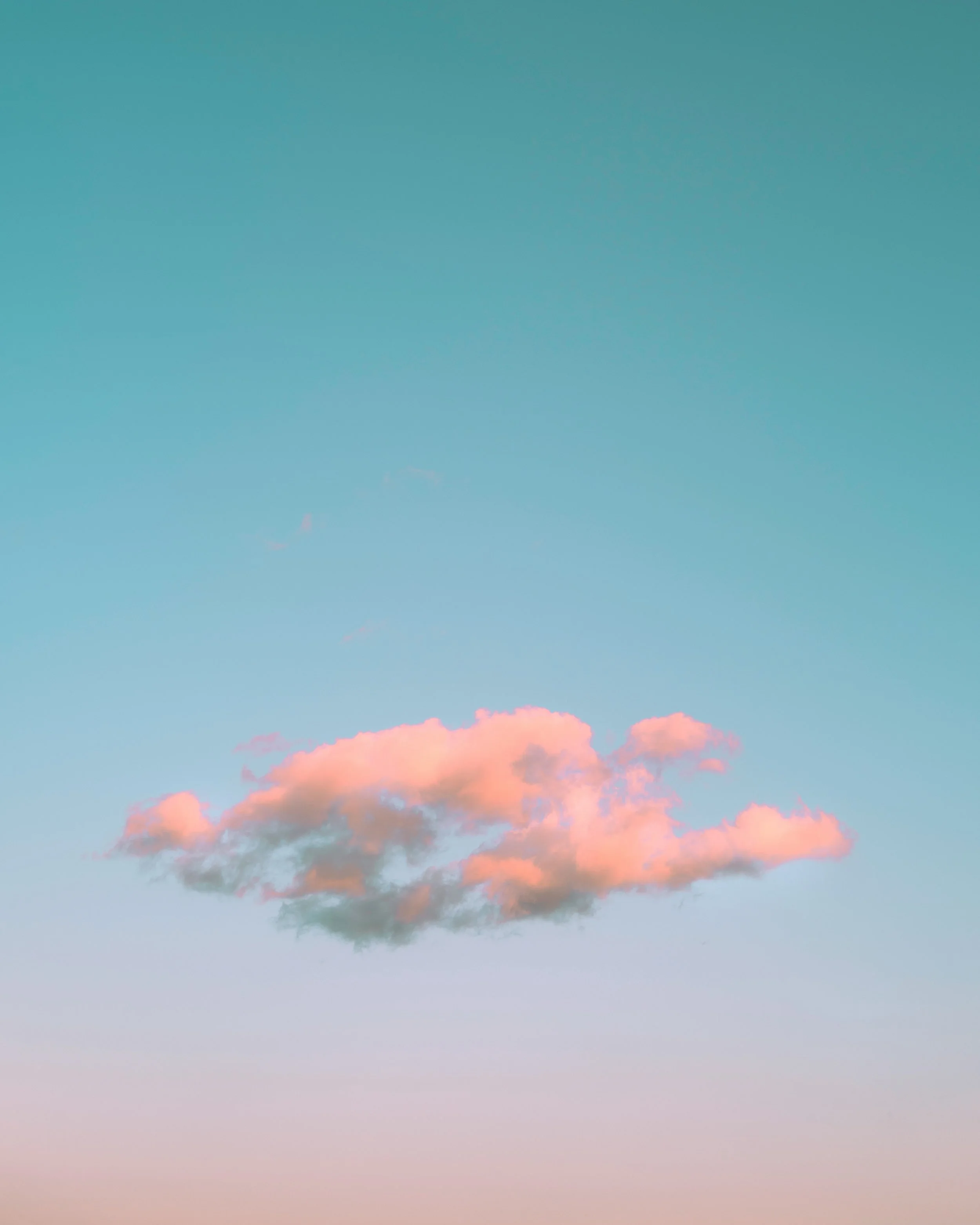 Sky with a gradient of soft pink to blue, featuring scattered light pink clouds.