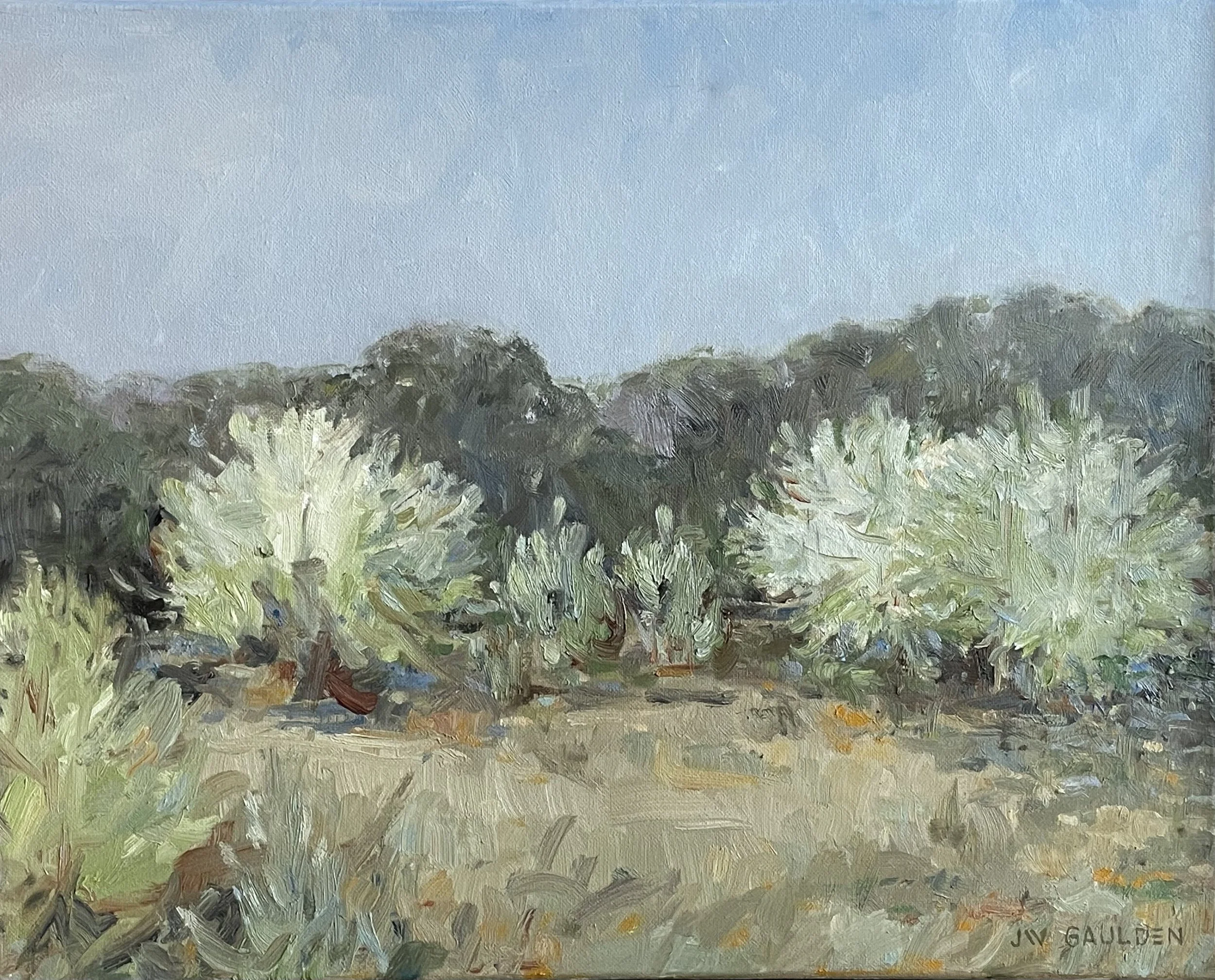 An impressionist landscape painting depicting wild pear trees in bloom set against a fallow field and greenery with a clear blue sky.